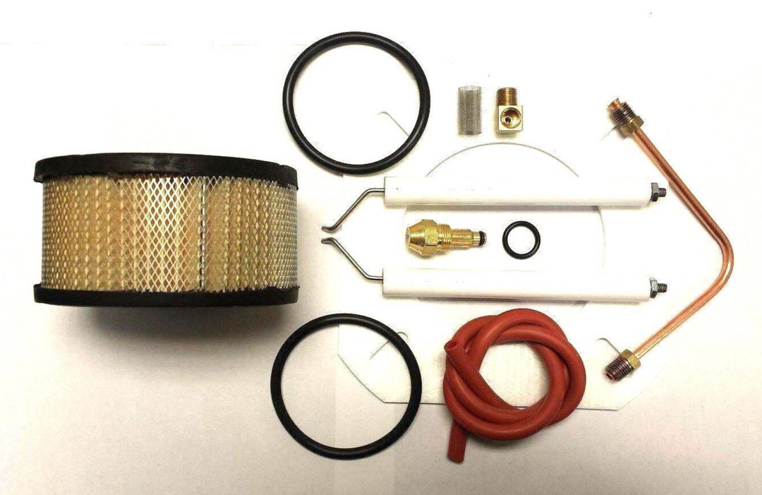 Reznor Burner Tune Up Kit consisting of 30609-8 nozzle, electrodes, air filter, oil heater o-rings (2), brass elbow, copper oil line, burner screen o-ring, burner screen, rubber hose, burner gasket, pump filter, pump gasket and oil filter.